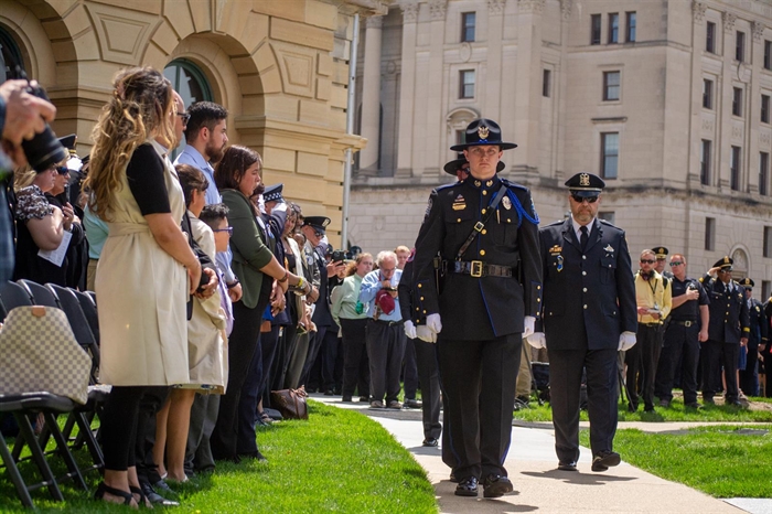 Uniformed officers honor the families of their fallen colleagues